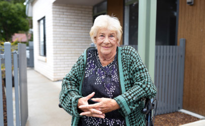 YourPlace Housing Tenant very happy out the front of her new home.