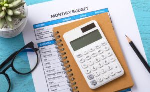 Calculating monthly budget with calculator and itemised expenses list – SA Financial Counsellors Association